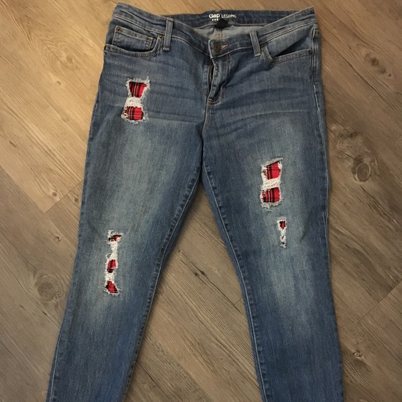 ripped jeans with red patches